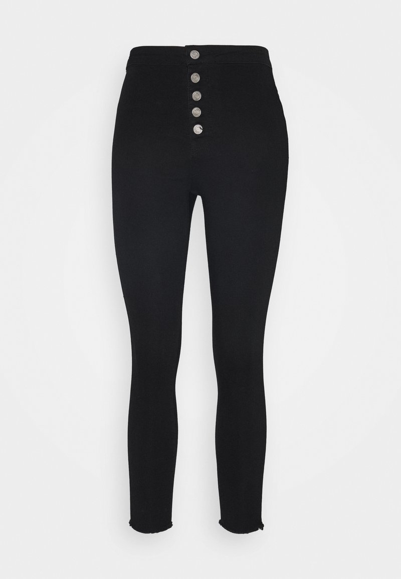 Jean skinny noir taille haute en denim, avec cinq boutons métalliques sur le devant, ourlet effiloché et texture lisse.