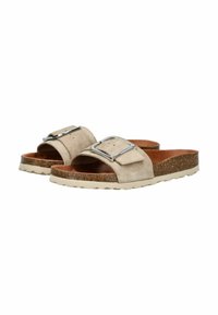 Sandales à glissière en daim beige avec un détail en boucle et une semelle en liège naturel. Le rembourrage offre du confort et présente une semelle extérieure texturée pour une meilleure adhérence.
