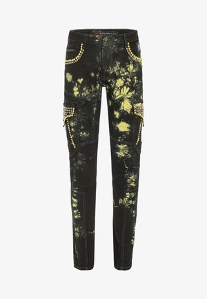 Schwarze Batik-Jeans mit gelben Akzenten, die mit Nieten verziert sind, mehreren Taschen und kontrastierenden Nähten. Slim-Fit-Design.