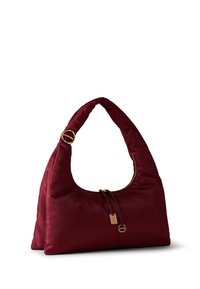 Burgundy hobo bag with a textured finish, a curved handle, and a gold-tone zipper pull. Features a structured, soft silhouette.