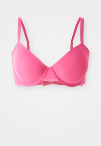 Trådløs BH i klar rosa, med glatte, formede kopper og blonde detaljer. Justerbare stropper og krok-og-løkke lukking bak.