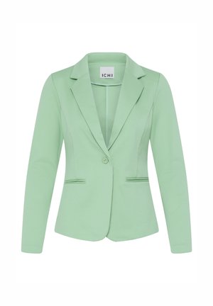 Lichtgroene, op maat gemaakte damesblazer met lange mouwen, enkele knoopsluiting, notch revers en twee voorzakken met paspel.