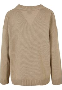 Pull beige en tricot à manches longues avec poignets, ourlet et col côtelés, vu de dos.