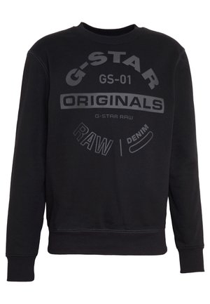 Schwarzer Sweatshirt mit langen Ärmeln, Rippbündchen an Ärmeln und Saum, mit dem Schriftzug "G-STAR ORIGINALS RAW DENIM" in verschiedenen Schriftarten quer über der Brust gedruckt.