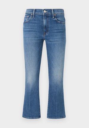 Blue denim jeans with slight fading, five-pocket style, button and zip closure, and slightly flared legs.