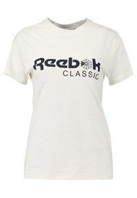 Bílé bavlněné tričko s kulatým výstřihem a krátkým rukávem. Na přední straně má výrazné logo "Reebok CLASSIC" v námořnické modři.