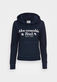 Sudadera azul marino hecha de suave mezcla de algodón, con bolsillo tipo canguro, capucha con cordón y texto en blanco con un logo de alce impreso en la parte delantera.
