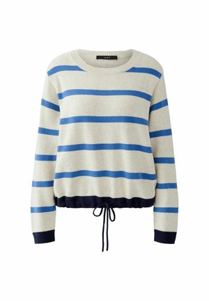 Pull rayé beige avec des rayures bleues. Il présente un col rond, des manches longues et un cordon de serrage à l'ourlet en bleu marine. Texture douce.