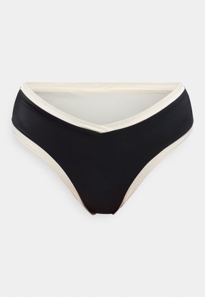 Svarte bikinibukser med hvit kant og V-formet midjebånd, vist flatt på hvit bakgrunn.