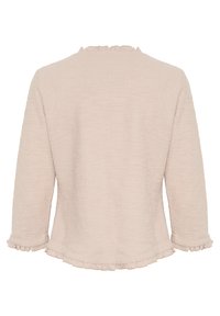 Svetlobežová blúzka s dlhým rukávom z textúrovanej látky, s volánovým výstrihom a manžetami, s voľným strihom a zakriveným lemom.