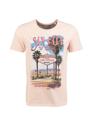 T-shirt beige avec une enseigne vintage de Las Vegas, des palmiers, des montagnes, et le texte "Sin City No Regrets" et "Unforgettable Adventures".