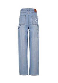Light blue denim cargo pants with a relaxed fit, featuring multiple pockets, visible stitching, and a brown leather patch on the back waistband.