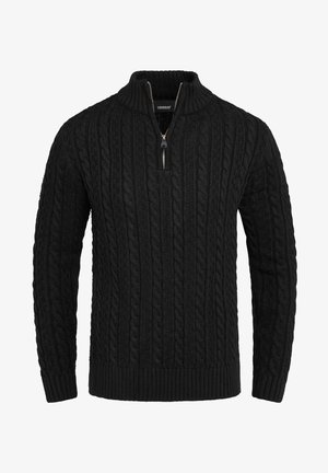 Pull noir en maille torsadée avec manches longues, poignets et ourlet côtelés, et une courte fermeture éclair frontale sur un col montant.