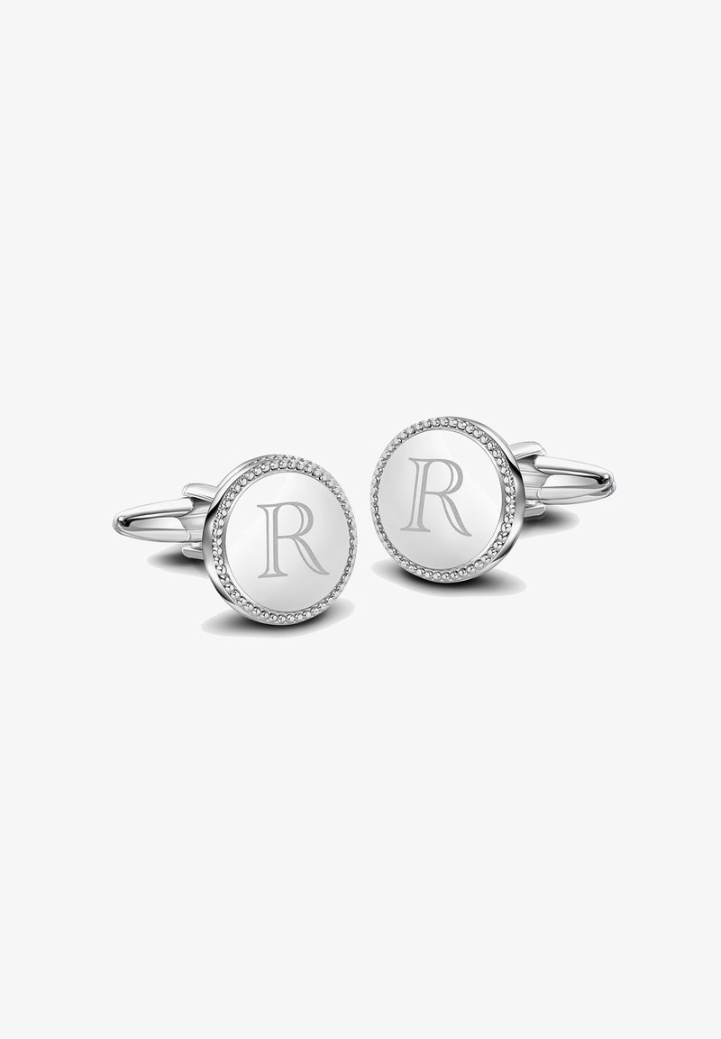 Okrągłe srebrne spinki do mankietów z gładką powierzchnią, koralikowym wykończeniem dookoła krawędzi oraz wygrawerowanym „R” w centrum.