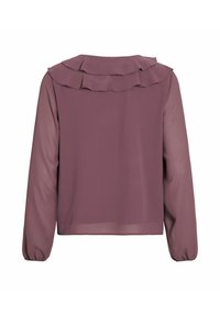 Langermet bluse i mauve, med en volangdetalj ved halsen og gjennomsiktig stoff. Mansjettene er samlet med elastikk for en tettsittende look.