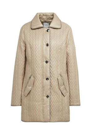 Beige gewatteerde jas met een glanzende afwerking, voorzien van een puntkraag, zes knopen en twee ritszakken aan de zijkant.