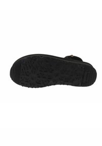 Suela de zapato negra con un patrón de agarre texturizado, que presenta diversas formas y letras incrustadas en la goma para tracción y estabilidad.