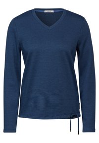 Blaues Langarmoberteil mit V-Ausschnitt, das mit einem strukturierten Karomuster und einem Kordelzug am Saum für eine verstellbare Passform ausgestattet ist. Hergestellt aus weichem Stoff.