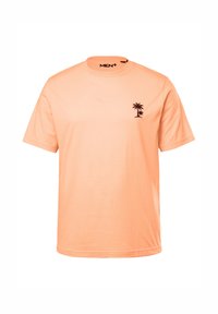 Camiseta de manga corta en melocotón claro, de material de algodón. Presenta un pequeño gráfico de una palmera negra en el pecho. Cuello redondo, corte relajado.