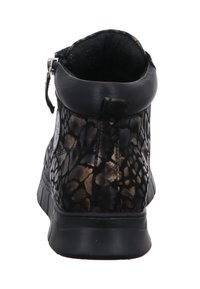 Black ankle boot with textured leather featuring a crackle pattern, a rounded toe, and a zip closure at the back. Flat rubber sole.