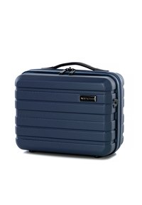 Valigia da viaggio rigida di colore blu navy con finitura texturizzata, scanalature orizzontali e manico nero. Dotata di chiusura a zip e accentuazione con logo.