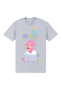 Šedé bavlněné tričko s růžovým medvědem, který drží barevné balónky, obklopený pastelovými srdíčky a mraky, s textem "CARE BEARS FOREVER."