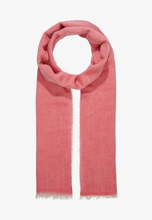 Miękki różowy wełniany szalik z delikatnym frędzlem na końcach, luźno złożony w okrągłą pętlę.