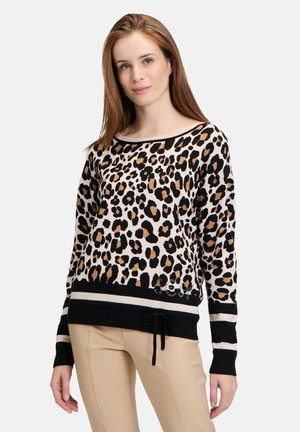 Leopard print sweater in beige, black, and brown, featuring a black striped hem and drawstring. Soft knit fabric with a relaxed fit.