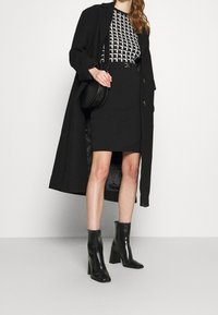 Morgan Tubino - black