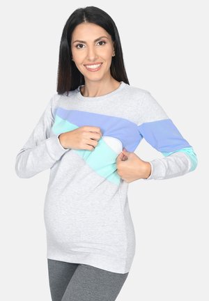 Grauer Pullover mit türkisfarbenen und hellblauen Akzenten. Verfügt über ein Panel für Barrierefreiheit, lange Ärmel und einen lockeren Schnitt.