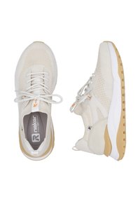 Beige athletic shoes with mesh upper, textured accents, and white rubber sole. Features include laces and branding on the tongue.