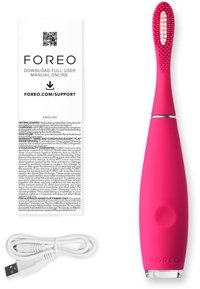 Electric toothbrush with a smooth, bright pink silicone body, textured brush head, and a clear base. Includes a white USB charging cable and user manual.
