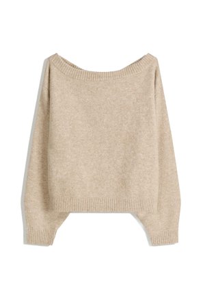 Beige neulotut villapaita, jossa on olkapäiden yli ulottuva muoto, ribbaustekniikalla tehdyt hihat ja helma. Pehmeä tekstuuri, hieman väljä istuvuus ja laatikkomainen muoto.