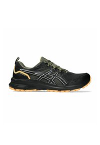 Black trail running shoes with a mesh upper, green accents, and orange rubber outsole. Features a reinforced toe and textured laces.