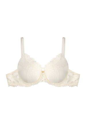 Underwire bra in cream with lace detailing, floral pattern, padded cups, adjustable straps, and a small gold accent at the center.