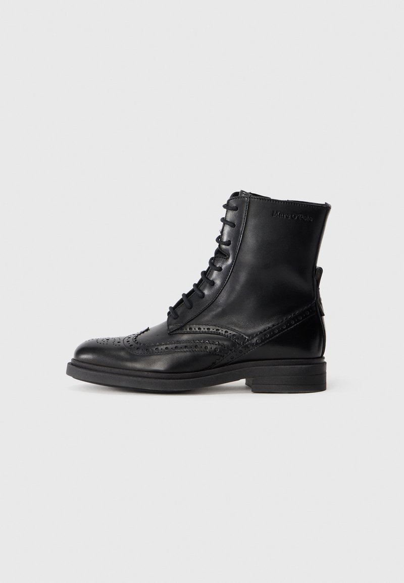 Black leather lace-up ankle boot with brogue detailing and low stacked heel, side zipper, and subtle brand logo near the top.