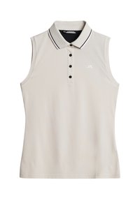 Ärm-lös polo skjorta i ljusbeige, med svart krage och vit kant, fem knappar framtill och en liten logotyp på bröstet. Slät textur.