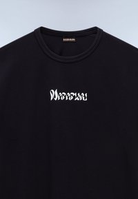 Black cotton t-shirt with a crew neck and a white stylized logo on the left chest area, featuring a smooth texture and casual design.