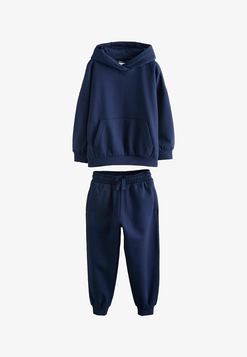 Sweat à capuche bleu marine avec poche avant et ensemble de pantalons de survêtement bleu marine assortis à taille élastique et poignets.
