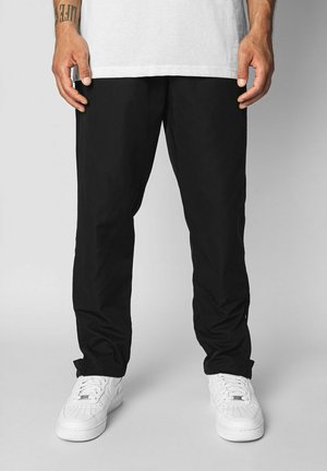 WIDE - Tracksuit bottoms - black