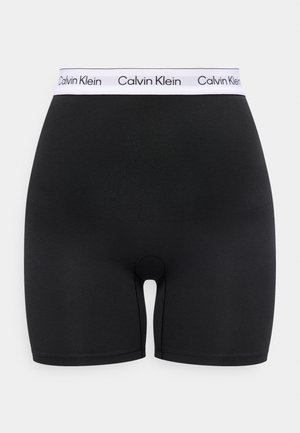 Zwarte boxer met hoge taille en een witte elastische tailleband met herhaalde zwarte "Calvin Klein" logo's.