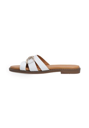 White leather slide sandal with three wide straps, featuring a metallic buckle detail. Brown textured sole with stitched accents.