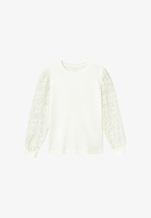 Top de manga larga blanca con cuerpo acanalado y mangas abullonadas de encaje transparente con patrones florales. Tela suave con puños ajustados.