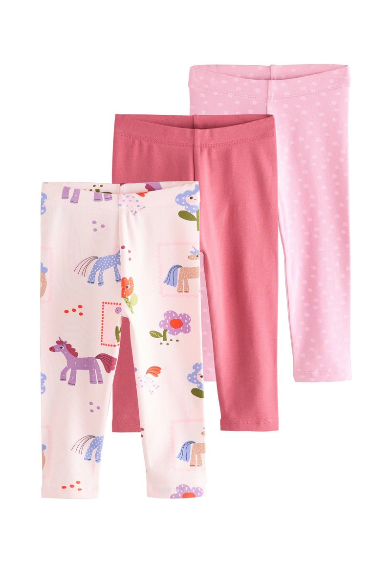 Three pairs of leggings: one features a light pink base with colorful unicorn and flower prints; others are solid pink and coral pink with dot patterns.