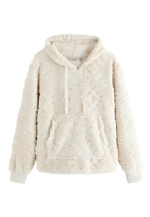 Krēmkrāsas fliša džemperis ar kapuci, reljefainiem ģeometriskiem rakstiem, priekšpusē kangaru kabata, auklas kapuce un ribota aproces.