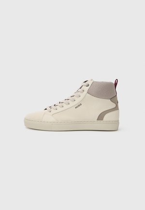 Beige high-top sneaker with light brown mesh collar, cushioned heel tab, lace-up front, and "HUGO" logo on the side.