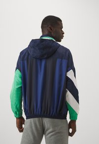Umbro PANELLED TRACK JACKET - Tréningová bunda - dark navy/peppermint