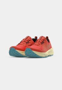 Red athletic shoes with a lightweight mesh upper, black accents, yellow midsole, and blue textured outsole. Features laces and logo details.