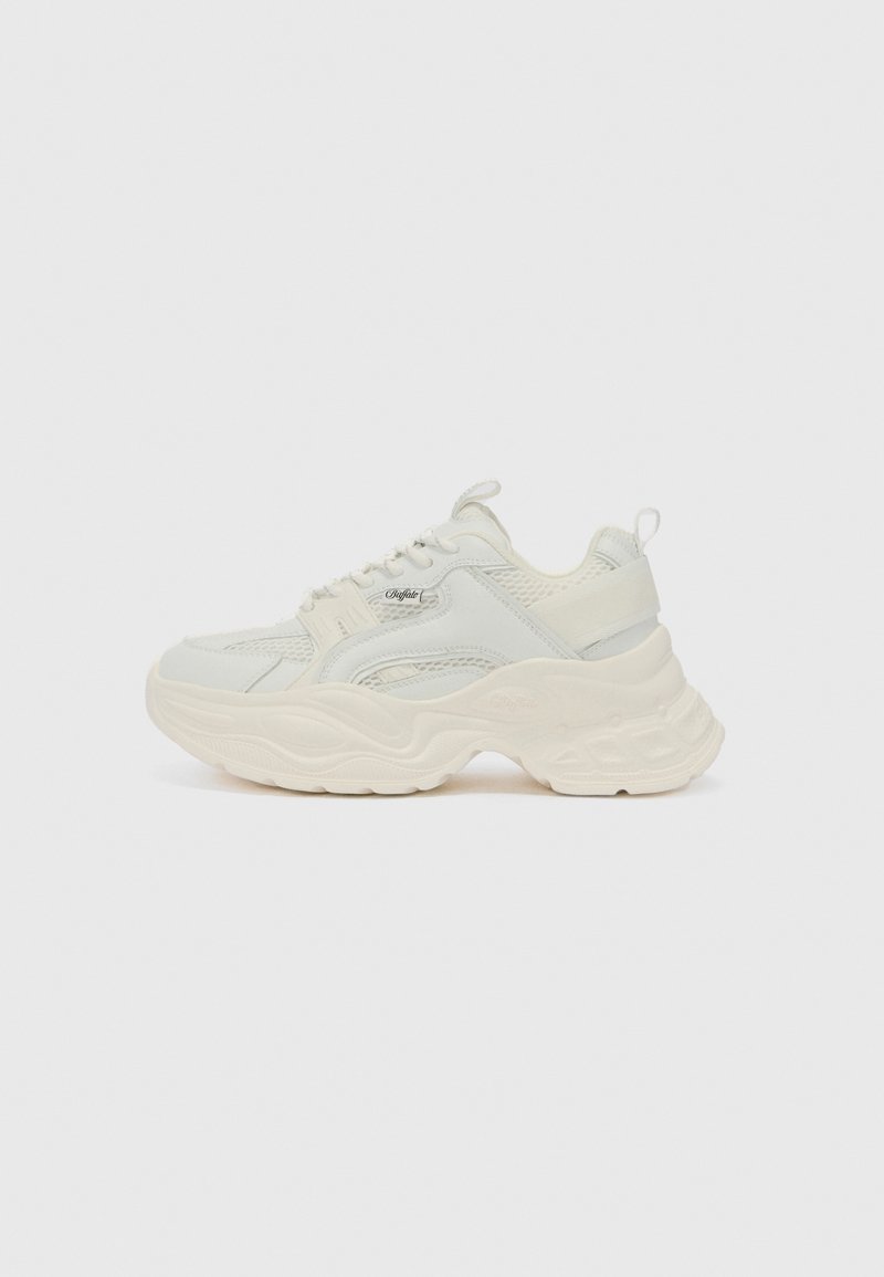 Chunky sneakers in off-white, featuring a textured mesh and smooth leather upper, with a thick, wavy sole and branded accents.