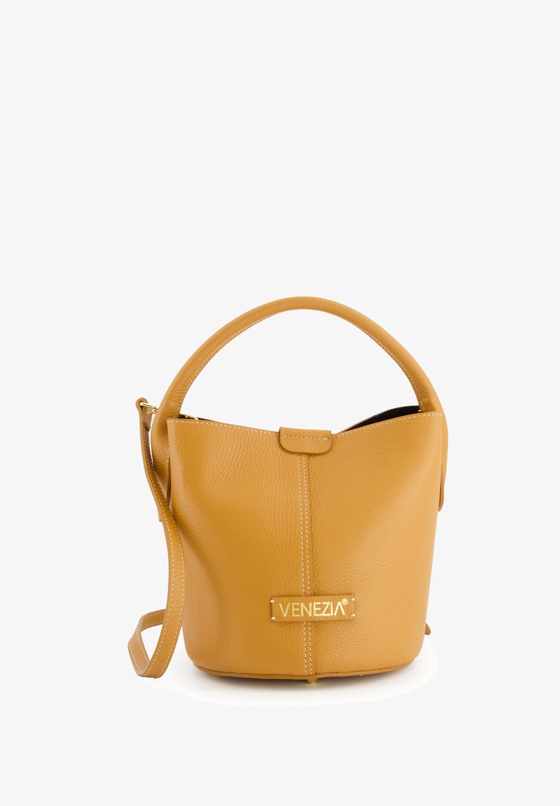 Yellow leather handbag with textured finish, rounded handle, removable shoulder strap, and gold logo accent on the front.